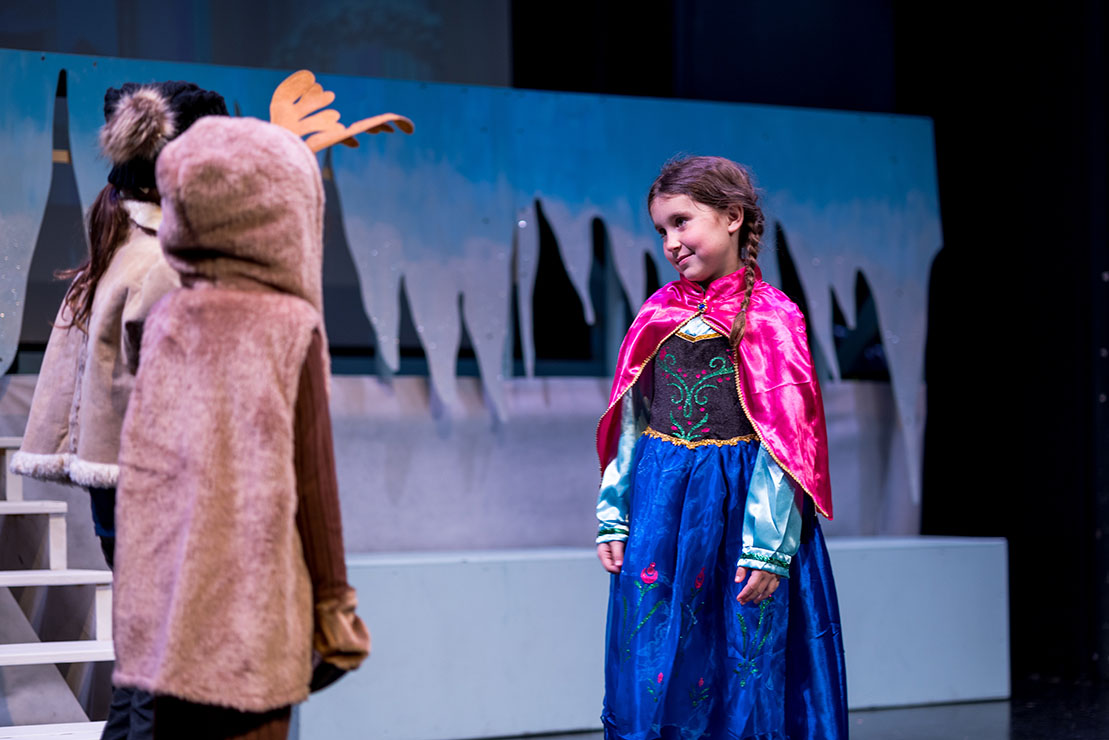 A child performing as Anna in Frozen Junior